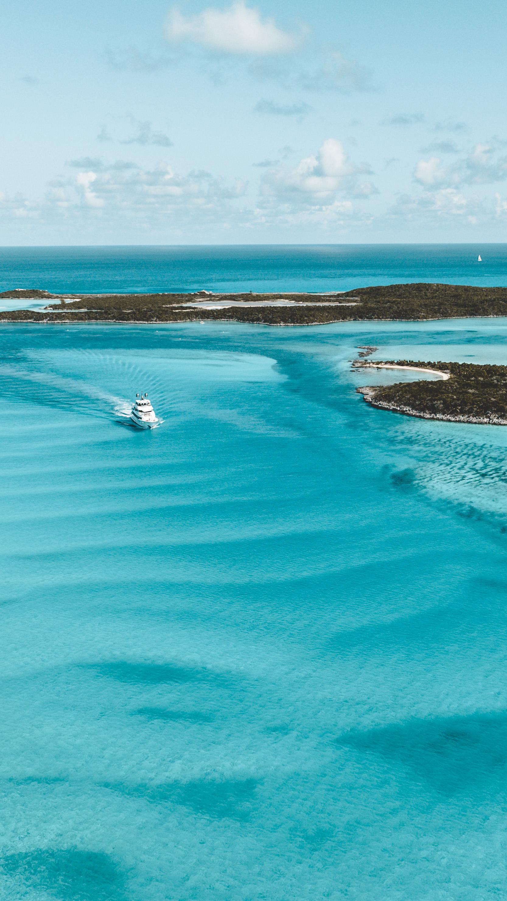 Aerial view of a yacht bow on turquoise water